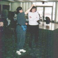 Barb Orr throws while Annette watches, 2001 tournament