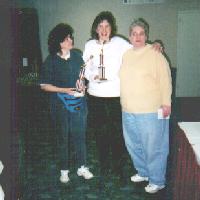 Barb O and Annette with trophies and Gail, 2001 tournament