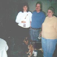 Denise and Curt with trophies and Gail, 2001 tournament