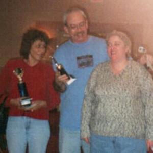 Jo S and Mike L with trophies, and Gail, 2000 tournament.