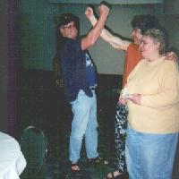 Kelly and Joe do a victory salute near Gail, 2001 tournament