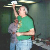 Mike Lee with award envelope, 2001 tournament