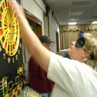 Barb B retrieving darts, 2003 tournament