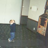 Gail's grandson, future darter, throwing at a board twice his size, 2001 tournament