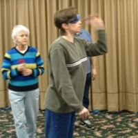 Annette throwing, Marlys watching, 2003 tournament