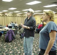 Richard throwing while someone watches, 2004 tournament